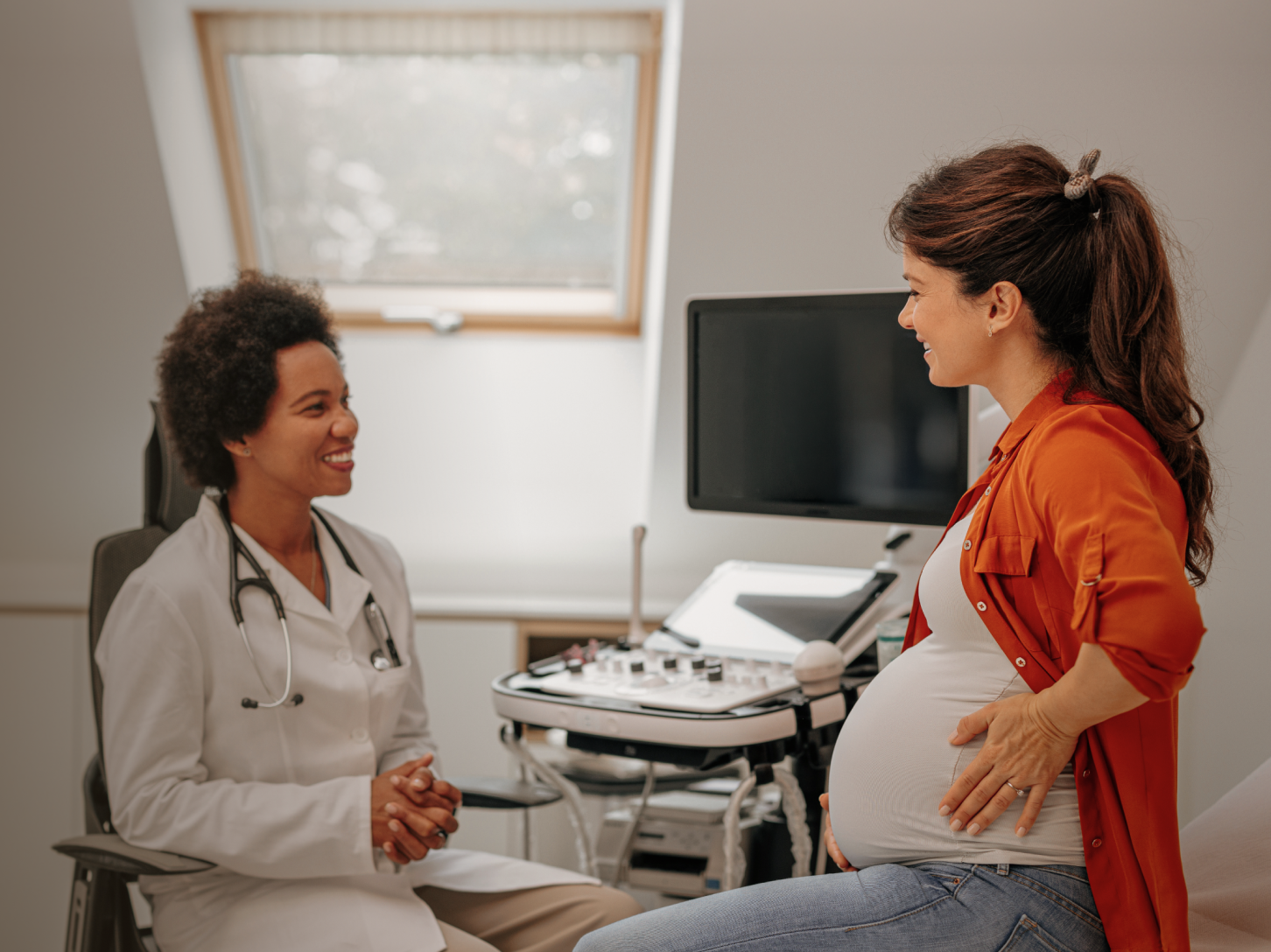 An expecting parent reviewing a prenatal visit summary on their phone